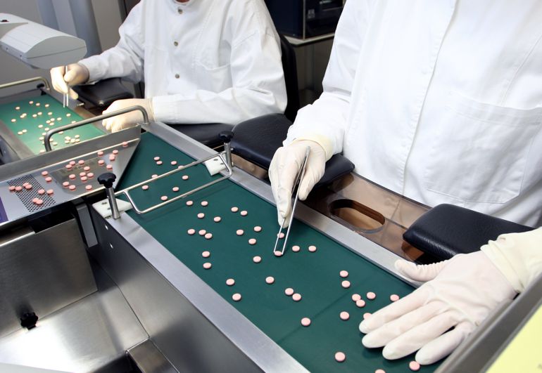 pharmacists counting pills