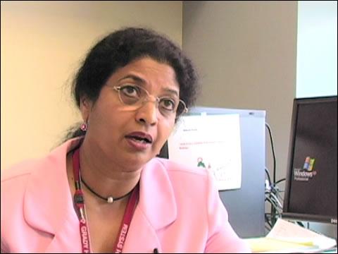 Veena Rao sitting in an office